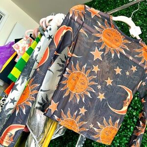 Very cute size small shear long sleeve moon and sun top. Very light